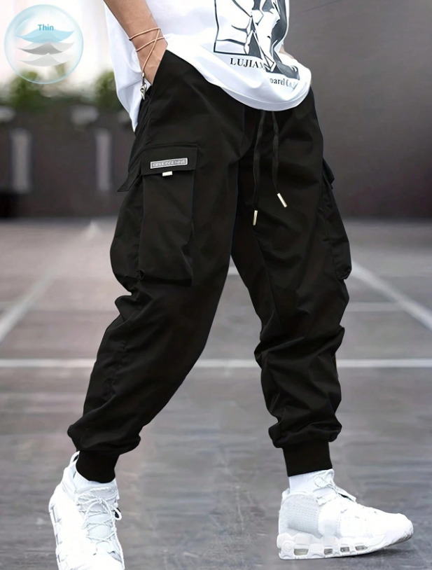 Pantalones cargo con bolsillo con solapa, cordón en la cintura y gráfico de letras